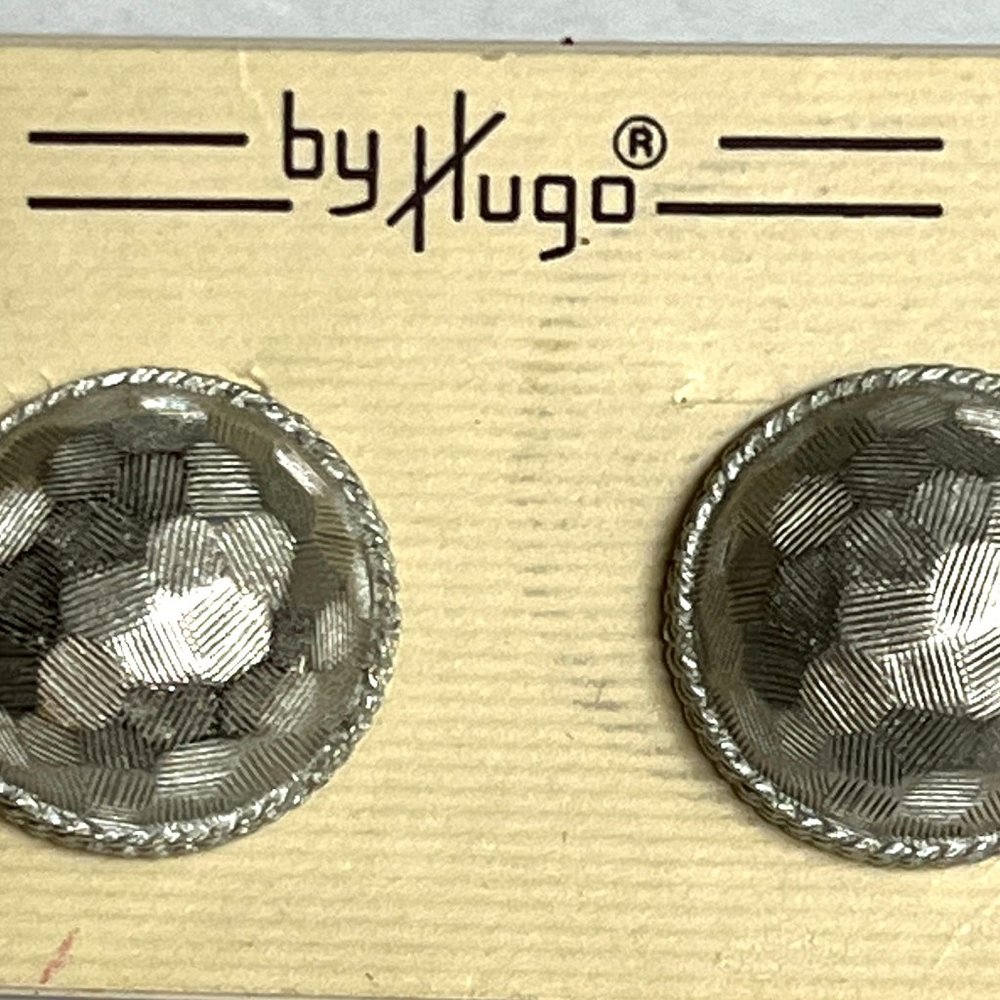 Silver tone dome earrings, texture finish, on card